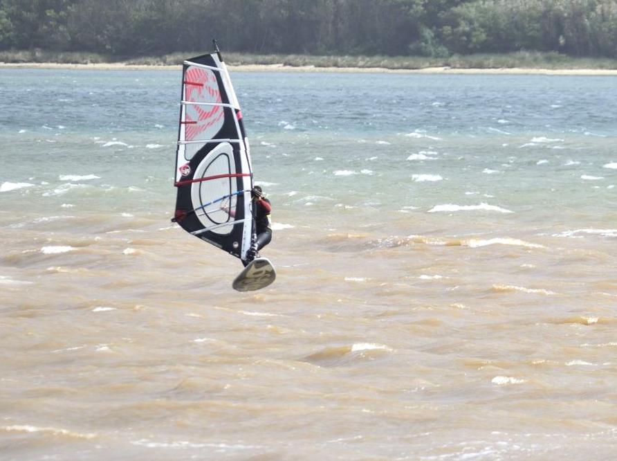 Enjoy Learning Windsurfing in a Relaxed Lagoon Setting